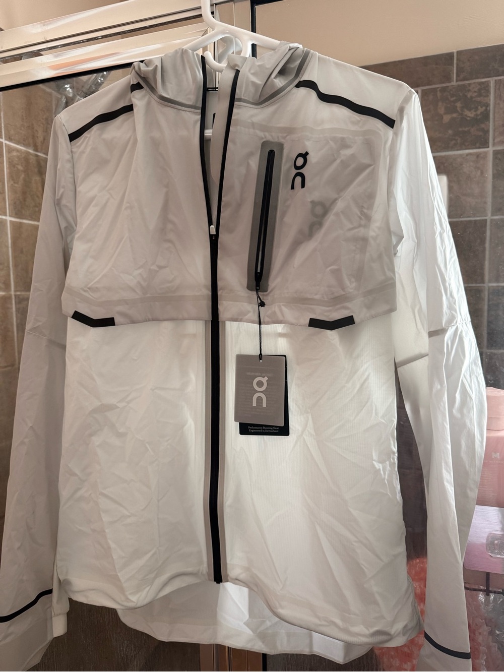 On Running White Woman’s Waterproof Hooded Running Raincoat